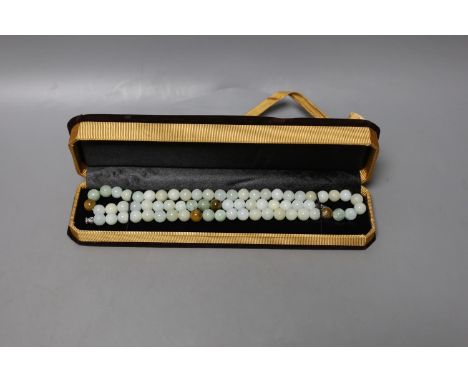 A boxed Chinese jade bead  bracelet