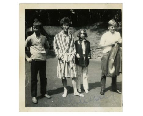 An original sixties black and white snapshot photograph of John Lennon taken by a fan at John’s Weybridge home Kenwood in sum