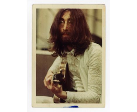 An original sixties colour photograph of John Lennon taken by Linda McCartney during recording for the album ‘Abbey Road’ at 