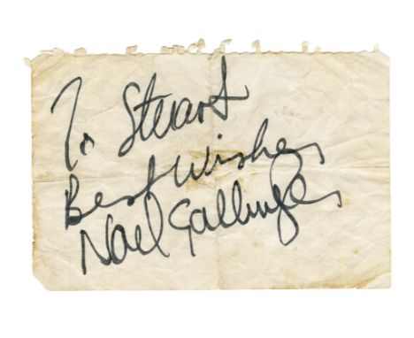 A piece of white notepaper that has been signed by Noel Gallagher in black marker pen. He has added the inscription ‘To Stuar