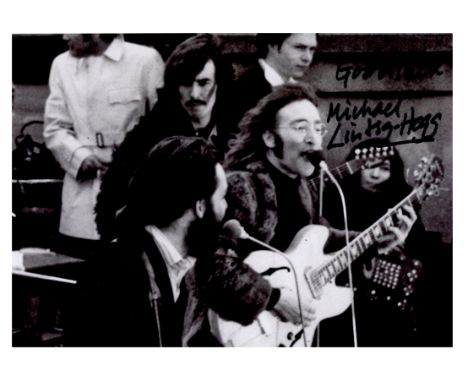 A black and white photograph of The Beatles that has been signed by Michael Lindsay-Hogg. He has added ‘Good luck’ before the