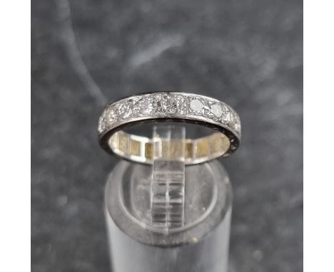 A diamond half eternity ring, size N 1/2.