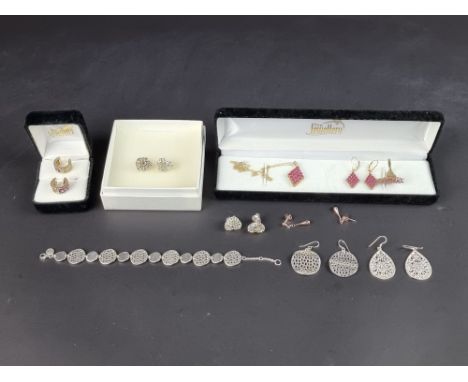 A cased white metal gem set pendant necklace, with matching earrings and ring, stamped '925'; together with another white met