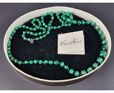 A vintage foiled green glass graduated bead necklace, hand knotted, approximately 100cm long, possibly Venetian.