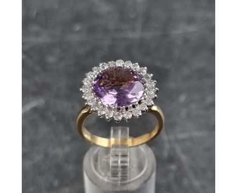 A 9ct amethyst and diamond cluster ring, with 2000 hallmark, size T, gross weight 5.9g.