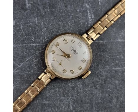 A Majex 9ct gold manual wind ladies wristwatch, 21.5mm, Ref. 060869, having Swiss made movement, on original integrated 9ct g