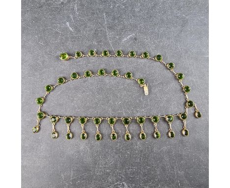 A vintage gold plated necklace, set with forty four faceted simulated green garnets, the clasp stamped '830', 42cm.