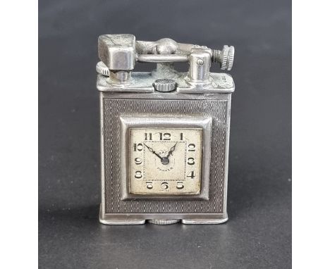 A silver Parker Beacon (Dunhill) novelty clock lighter, import&nbsp;marks Alfred Dunhill Ltd, London 1928, variously stamped,