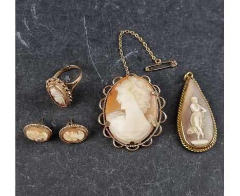 A 9ct gold and carved shell cameo ring, size L; together with a similar pair of ear studs; a carved shell cameo brooch, with 