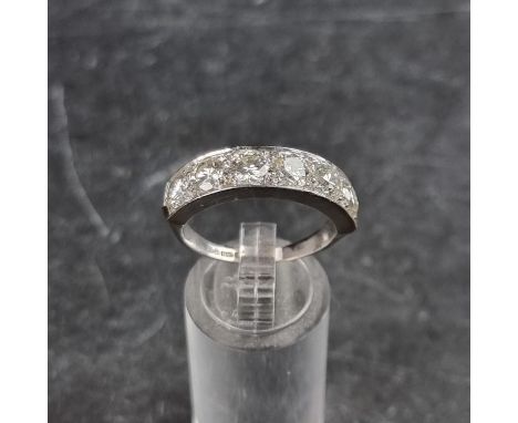 A 14ct white gold diamond six stone half eternity ring, the diamonds estimated at a total of 2.5ct, London 1977, size S, gros