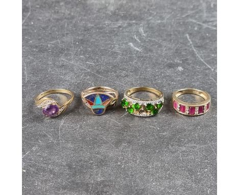 Three 9ct gold gem set rings, together with a yellow metal stone set ring, with Egyptian mark for 18k. (4)