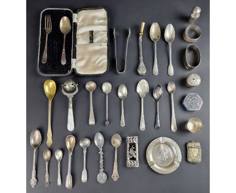 A white metal ashtray, stamped '830', 81mm diameter; together with a silver napkin ring; a cased silver fork and spoon; and a