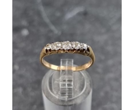 A yellow metal diamond five stone ring, stamped 18ct, size P.