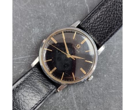 A 1959 Omega 'black dial' stainless steel manual wind wristwatch, 33mm, Ref. 14387 2 SC, Cal. 520, on original black leather 