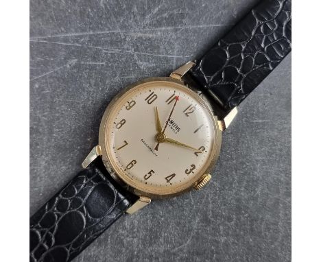 A 1960s Smiths gold plated manual wind wristwatch, 33mm, on black leather strap.