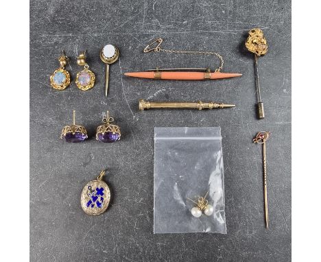 A pair of yellow metal amethyst ear studs, 14mm diameter; together with a yellow metal ruby set stick pin, stamped '9c', 55mm
