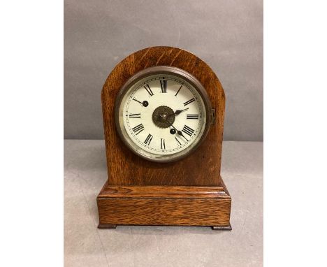An oak case eight day mantle clock by  Fehrenbach Bros