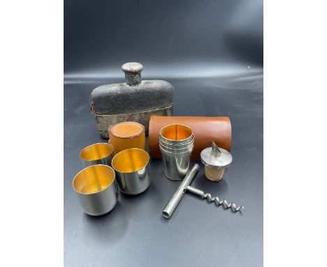 A selection of travelling drink related items to include a hip flask and twos cased sets of metal travelling cups or stirrup 