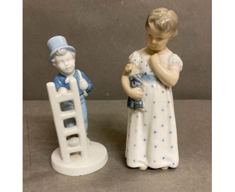 A Royal Copenhagen figure of a girl with a doll and a porcelain figure of a boy or a ladle 