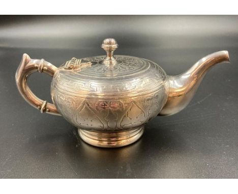 A silver plated bachelor teapot marked Fraget W Warszawie to base.