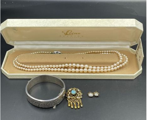 A selection of quality jewellery including opal earrings, silver bangle, pearl necklace etc.