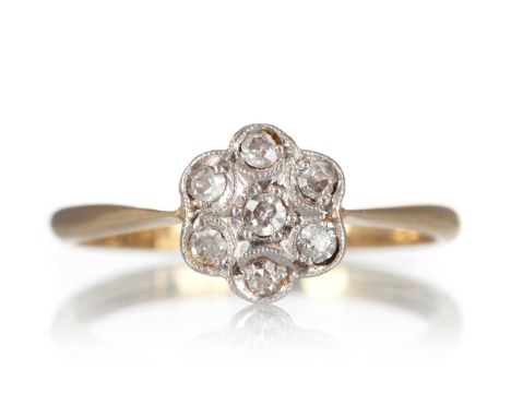 DIAMOND DAISY CLUSTER RING, set with mixed cut diamonds totalling approximately 0.35 carats, in eighteen carat gold, size M 1