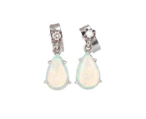 OPAL RING AND A PAIR OF EARRINGS, the ring set with oval opal and flanked by three diamonds, the earrings set with a single d