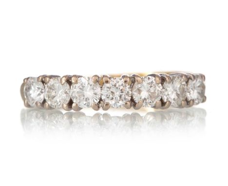 DIAMOND SEVEN STONE RING, set with round brilliant cut diamonds totalling approximately 1.20 carats, in eighteen carat gold, 