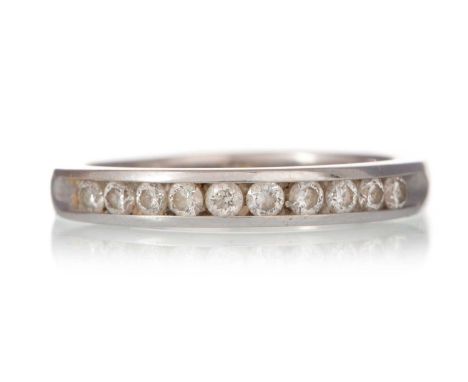 DIAMOND BAND, with channel set diamonds totalling approximately 0.50 carats, marked 14K, size K 1/2Qty: 2.5g