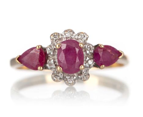 RUBY AND DIAMOND RING, set with oval and pear shaped rubies and small diamonds, in nine carat gold, size L 1/2Qty: 2.4g