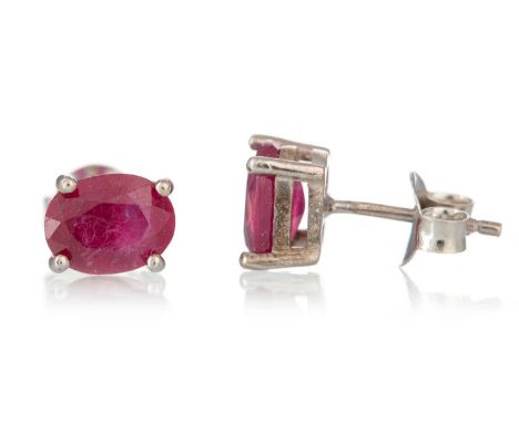 PAIR OF TREATED RUBY STUD EARRINGS, in silver