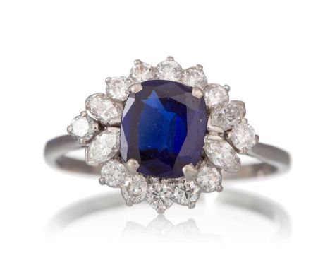 SAPPHIRE AND DIAMOND RING, set with a cushion cut sapphire flanked by round and marquise cut diamonds, unmarked, size SQty: 4