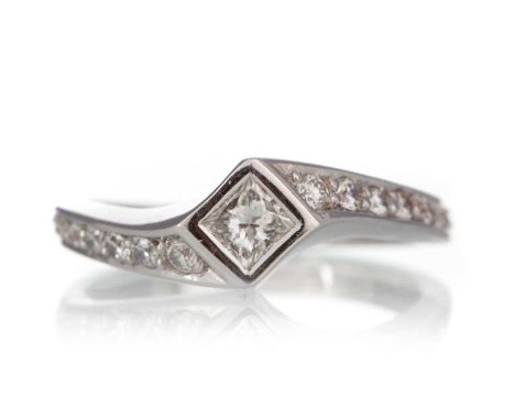 DIAMOND TWIST RING, set with central princess cut diamond with round brilliant cut diamonds to the entire shank, in eighteen 