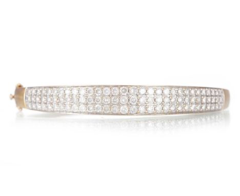 DIAMOND BANGLE, set with round brilliant cut diamonds totalling approximately 4.00 carats, in nine carat goldQty: 14.5gWorn c
