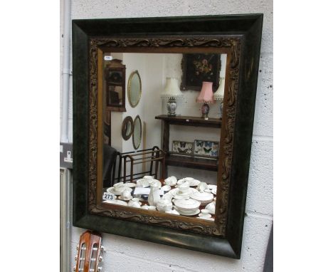 Ornately framed wall mirror