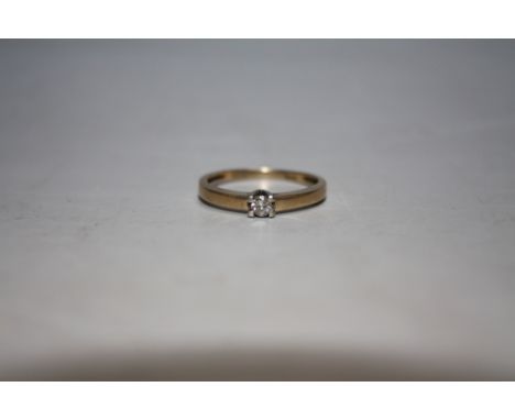 A 9 CARAT GOLD DIAMOND SOLITAIRE RING, ring size O 1/2