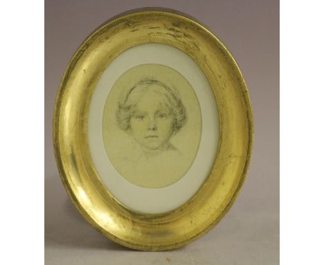 AN OVAL PORTRAIT MINIATURE ON SILK OF A YOUNG GIRL, unsigned, mixed media on silk, framed and glazed, 9 x 7 cm