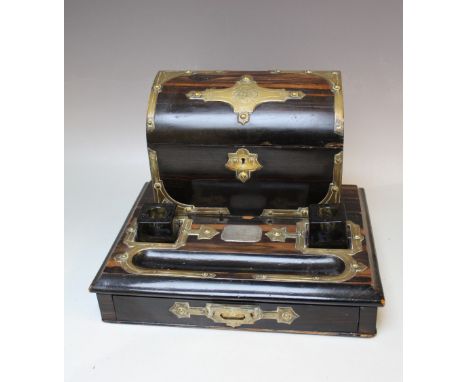 A 19TH CENTURY COROMANDEL STATIONARY DESK STAND WITH BRASS MOUNTS, the hinged lid  compartment above two later glass inkwells