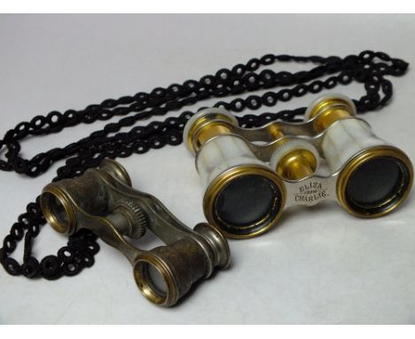 A PAIR OF LEMAIRE OF PARIS MOTHER OF PEARL OPERA GLASSES, together with a smaller pair of opera glasses having embossed metal