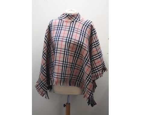 A VINTAGE BURBERRY CAPE / PONCHO, with fringe detailing to bottom edge, one size