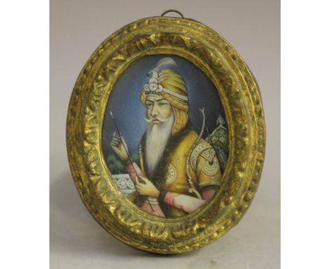 (XIX). Indian school, oval portrait miniature of a Sultan with bow and arrow, unsigned, mixed media on paper laid on card, fr