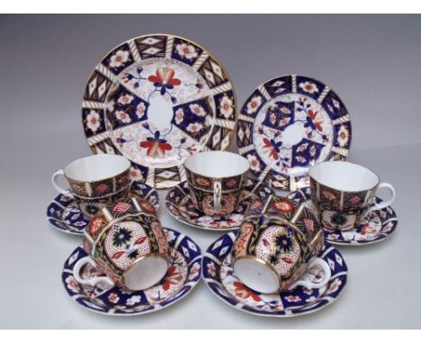 A COLLECTION OF ROYAL CROWN DERBY TEAWARE, various dates and patterns, comprising five cups, five saucers, one tea plate - Di