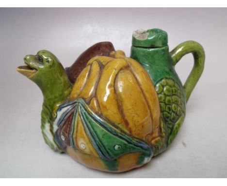 AN UNUSUAL SMALL MAJOLICA TEAPOT, the spout in the form of a mythical winged beast, W 15.5 cm S/D