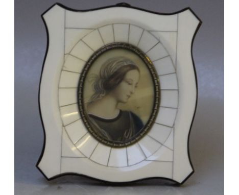 (XX). An oval portrait miniature on ivorine of a young woman, indistinctly signed middle right, framed and glazed, 7 x 5 cm