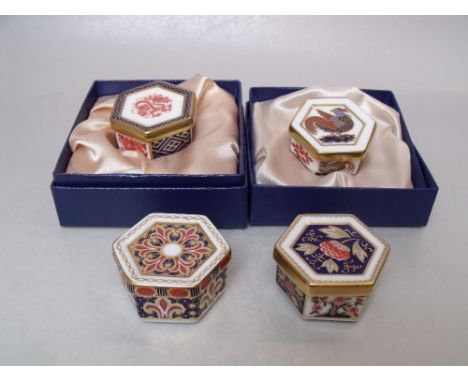 FOUR ROYAL CROWN DERBY HEXAGONAL LIDDED TRINKET POTS, comprising two boxed examples A 1299, A 1295 and two unboxed examples A