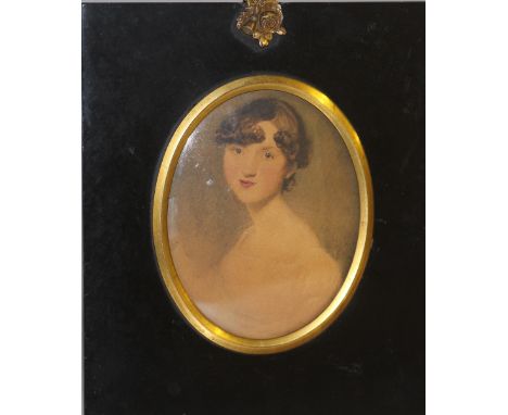 (XIX). Oval portrait miniature of a young lady, unsigned, watercolour on paper, framed and glazed, frame with acorn finial, 9