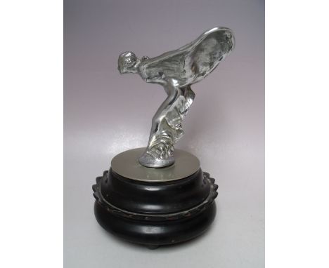 A VINTAGE CHROMED STATUETTE / CAR MASCOT OF 'THE SPIRIT OF ECSTASY',  raised on a circular base, statuette H 13 cm, overall H