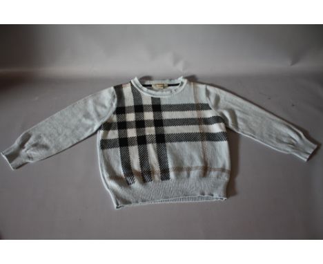 A CHILDS VINTAGE BURBERRY JUMPER, pale blue with traditional Burberry design