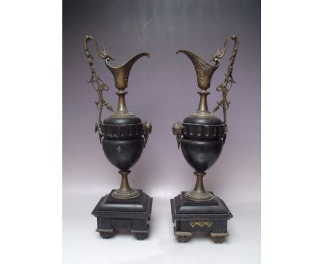 A PAIR OF NEOCLASSICAL STYLE MANTLE URNS / GARNITURES, the metal mounts depicting a mythical bird to the handle and applied m