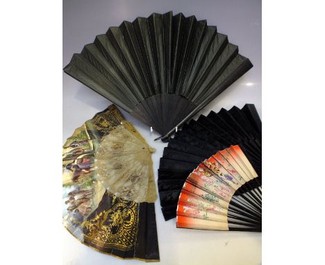 THREE VINTAGE EBONISED FOLDING FANS, together with a lucite example depicting matadors and bull fighting (4) 